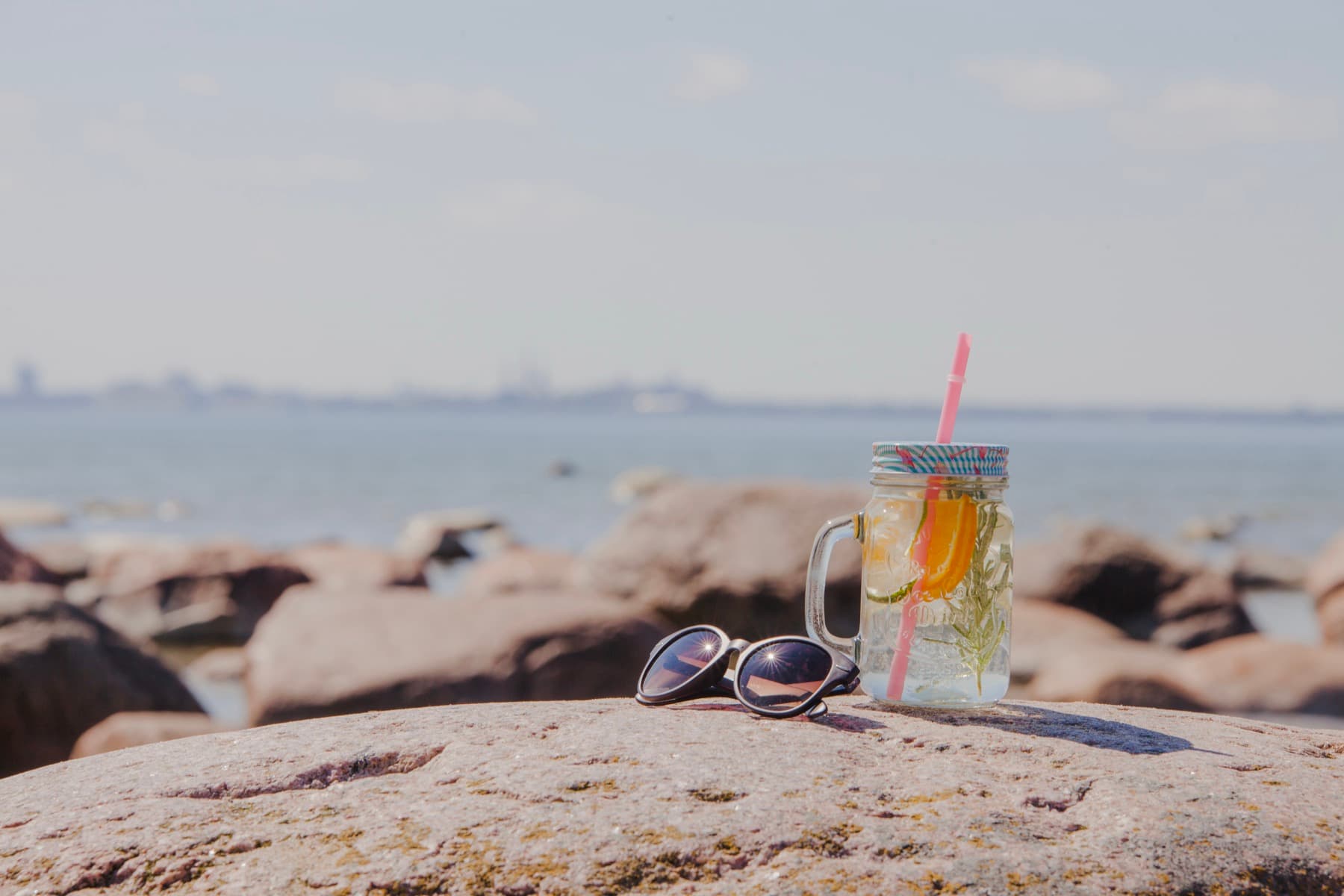 Fresh drink on the rocks by the sea after a surf session in Fuerteventura
